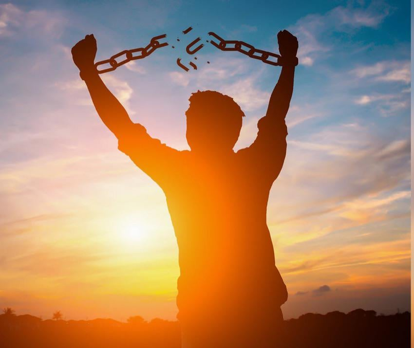 Guy breaking free from chains to show you can get out of debt